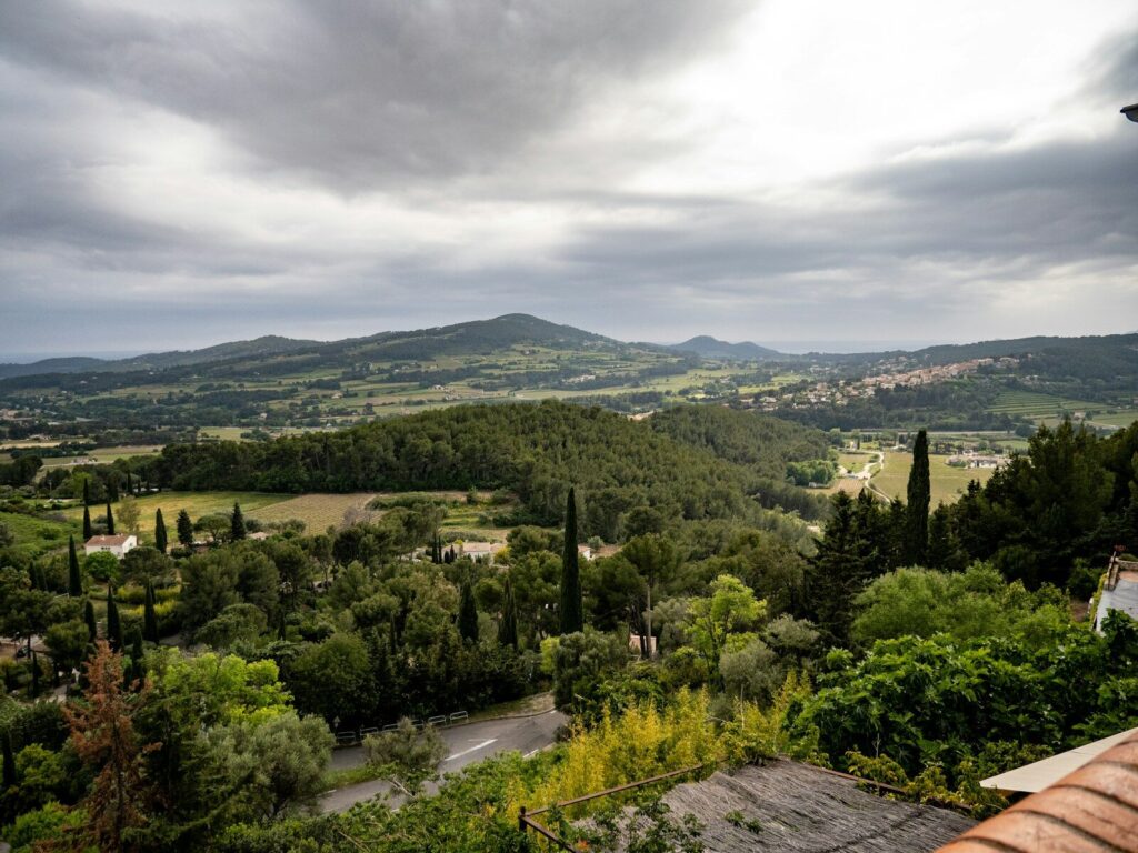 Overlooking a lush valley and rolling hills.